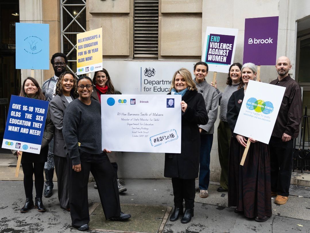 make it mandatory Different organisations stood together holding signs up about making RSE mandatory for 16-18 year olds